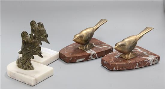 Two pairs of Art Deco bookends of birds, on marble bases